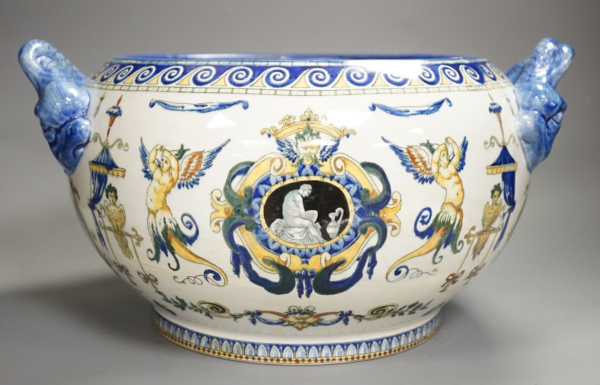 A French 19th century Gien pottery jardiniere with dolphin handles, 41 cms wide including handles.